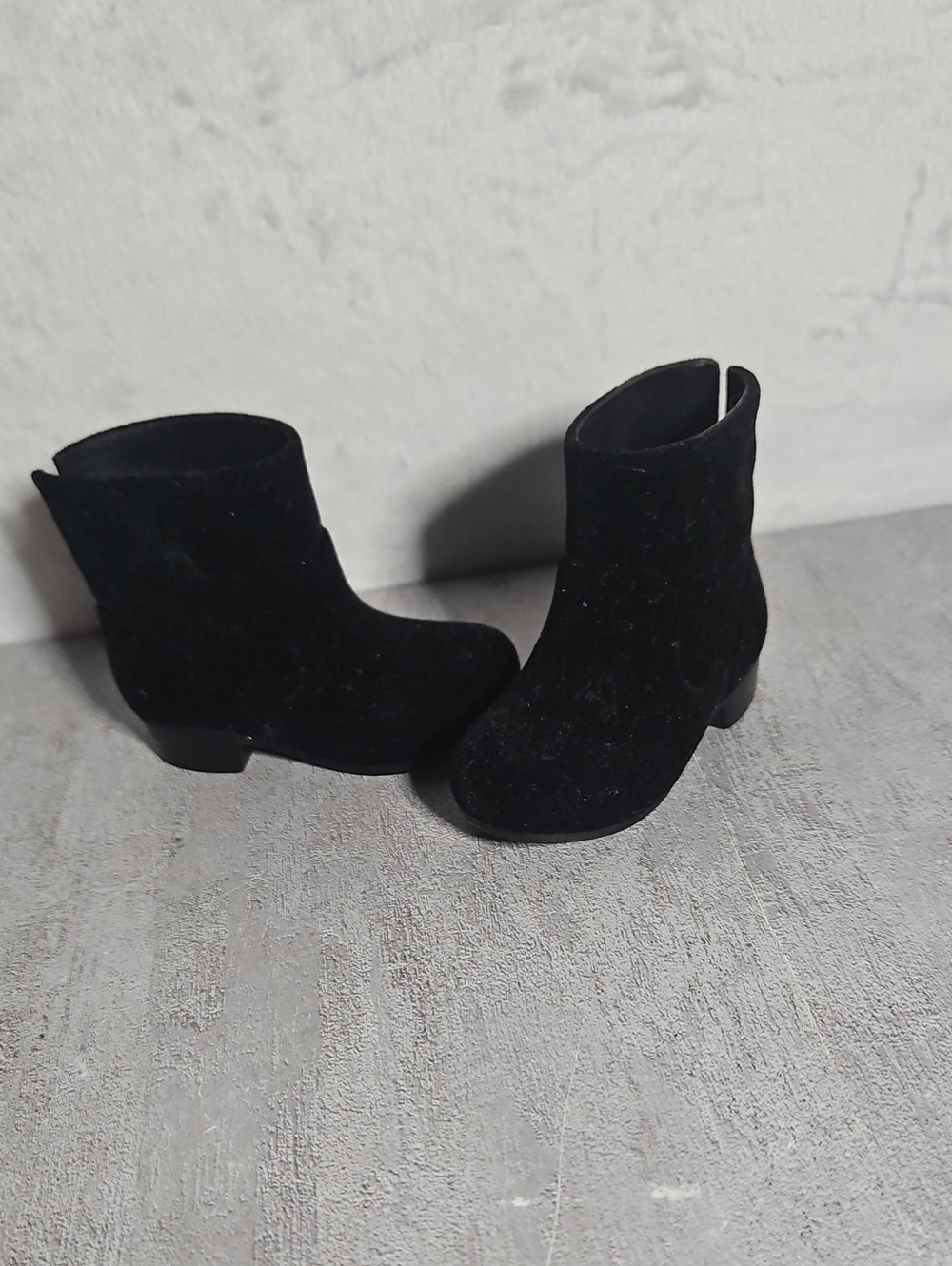 Pair of black ankle boots for a doll